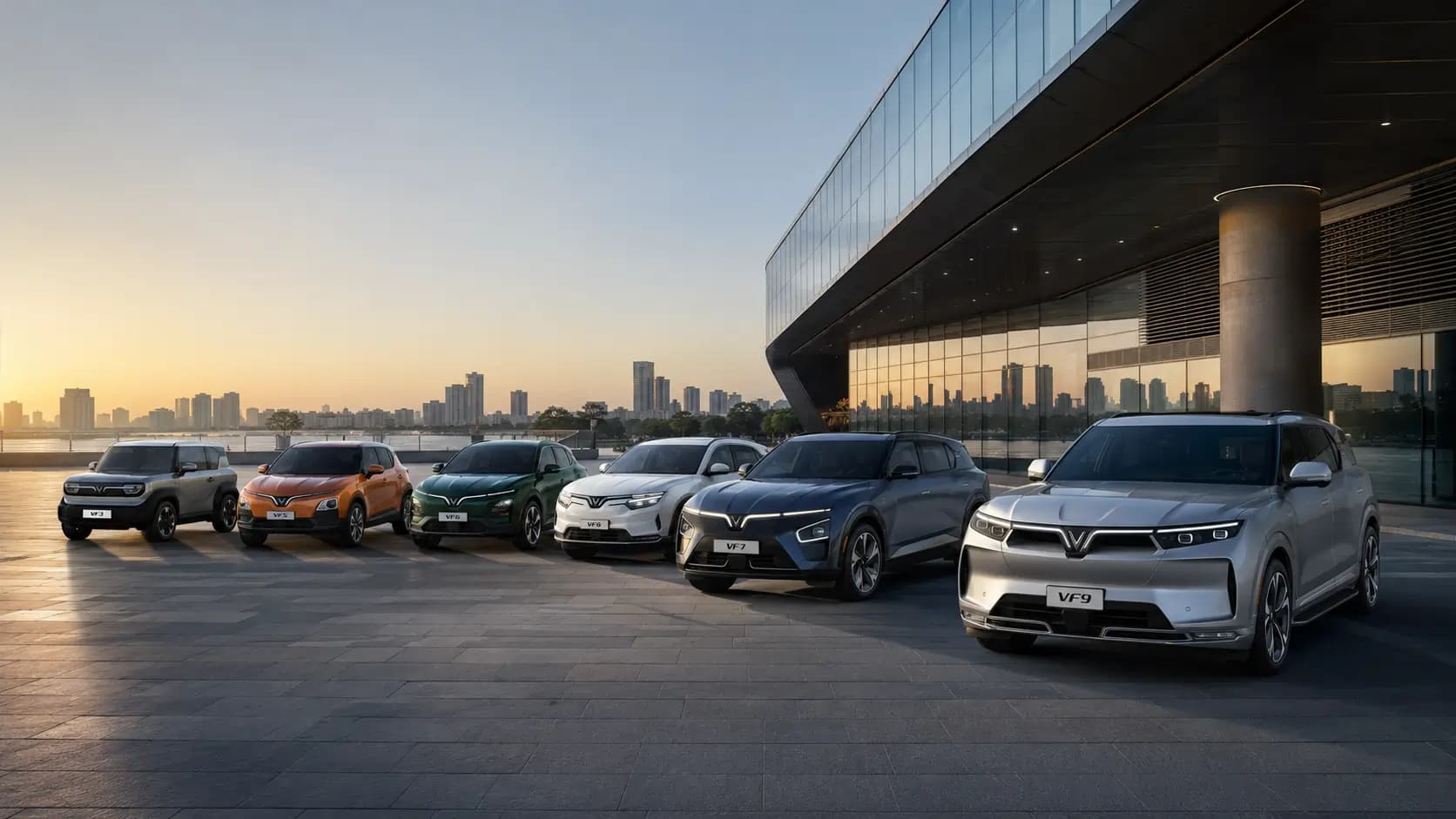 The VinFast electric vehicle line-up outside a modern showroom at dusk — the range an India dealer would retail.